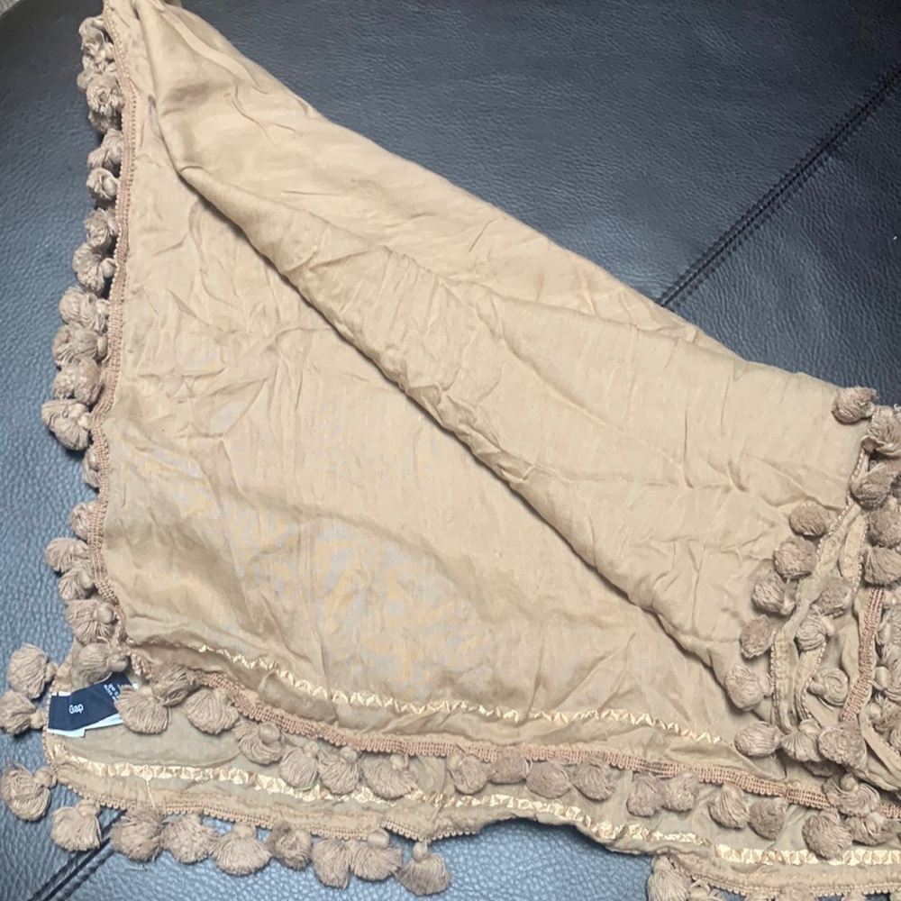Cute long tan rectangle scarf with ball tassels and border stitching